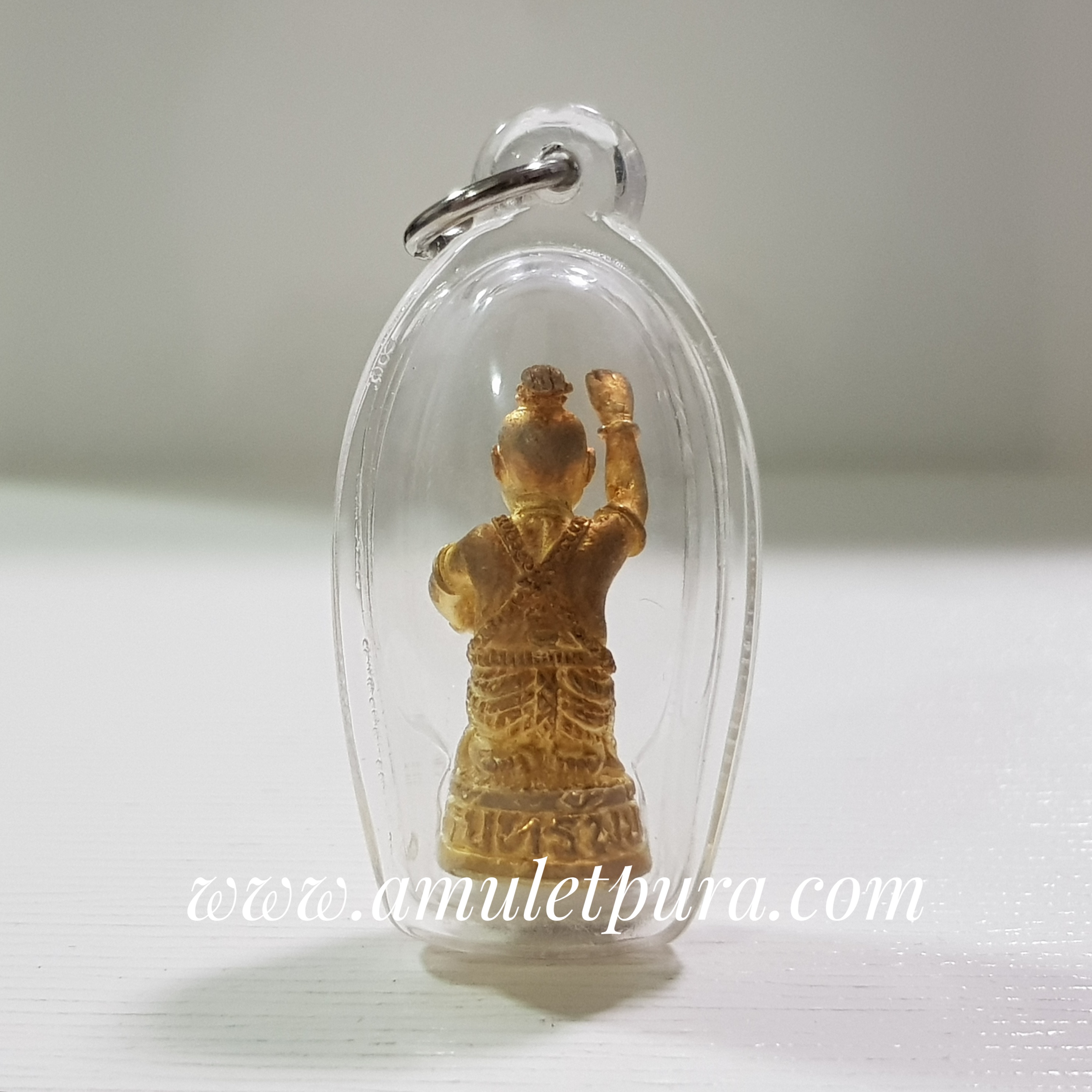 กุมารรับทรัพย์ รุ่นรับทรัพย์(โลหะชุบทองปัดเงา)ปี45 หลวงปู่ชื่น วัดตาอี จ.บุรีรัมย์(ตอกโค้ด อุดผงใต้ฐาน พร้อมเลี่ยมกันน้ำ)