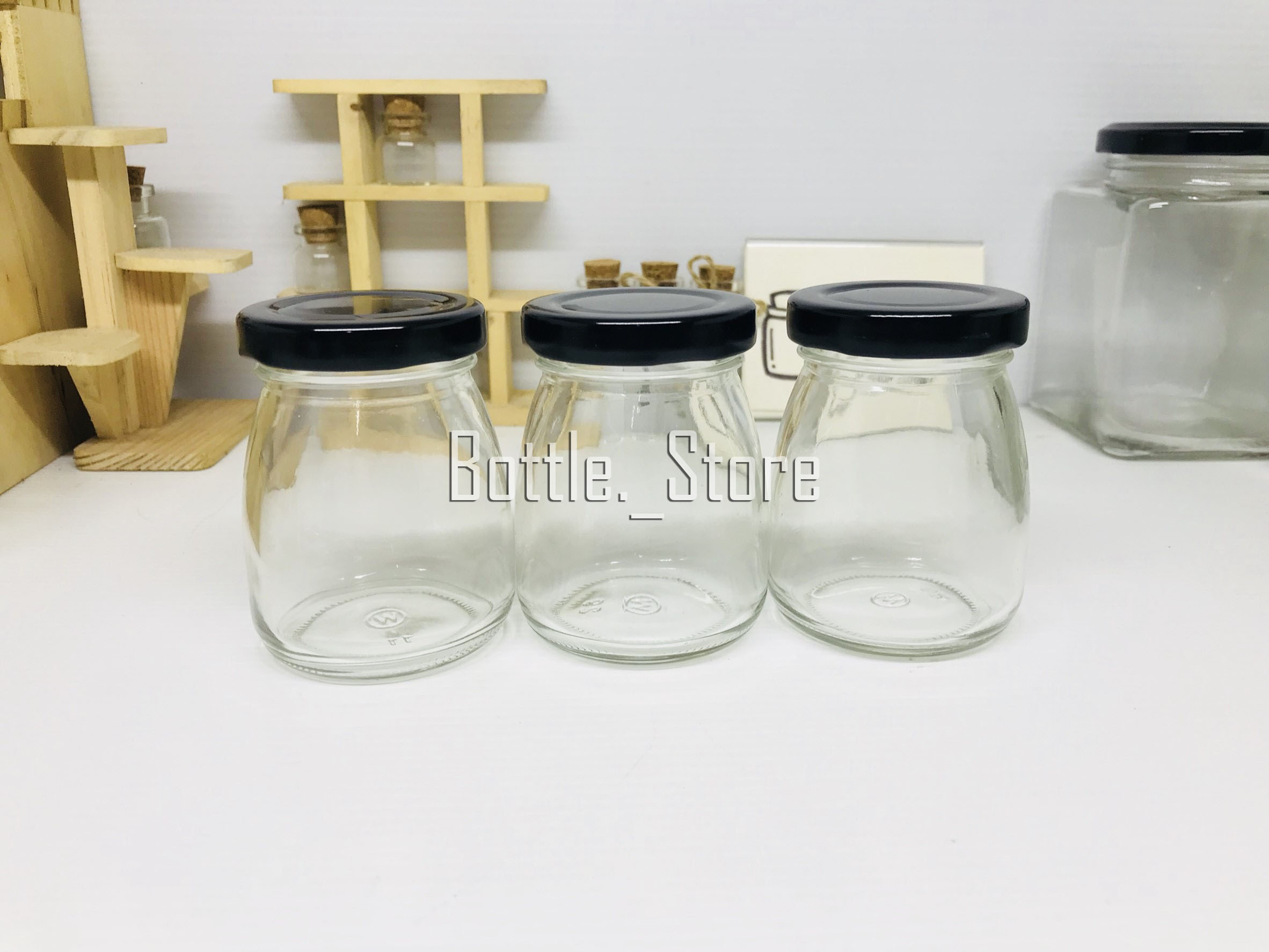 ขวดแก้ว พุดดิ้ง 100ml ฝาเกลียวล็อคสีดำ