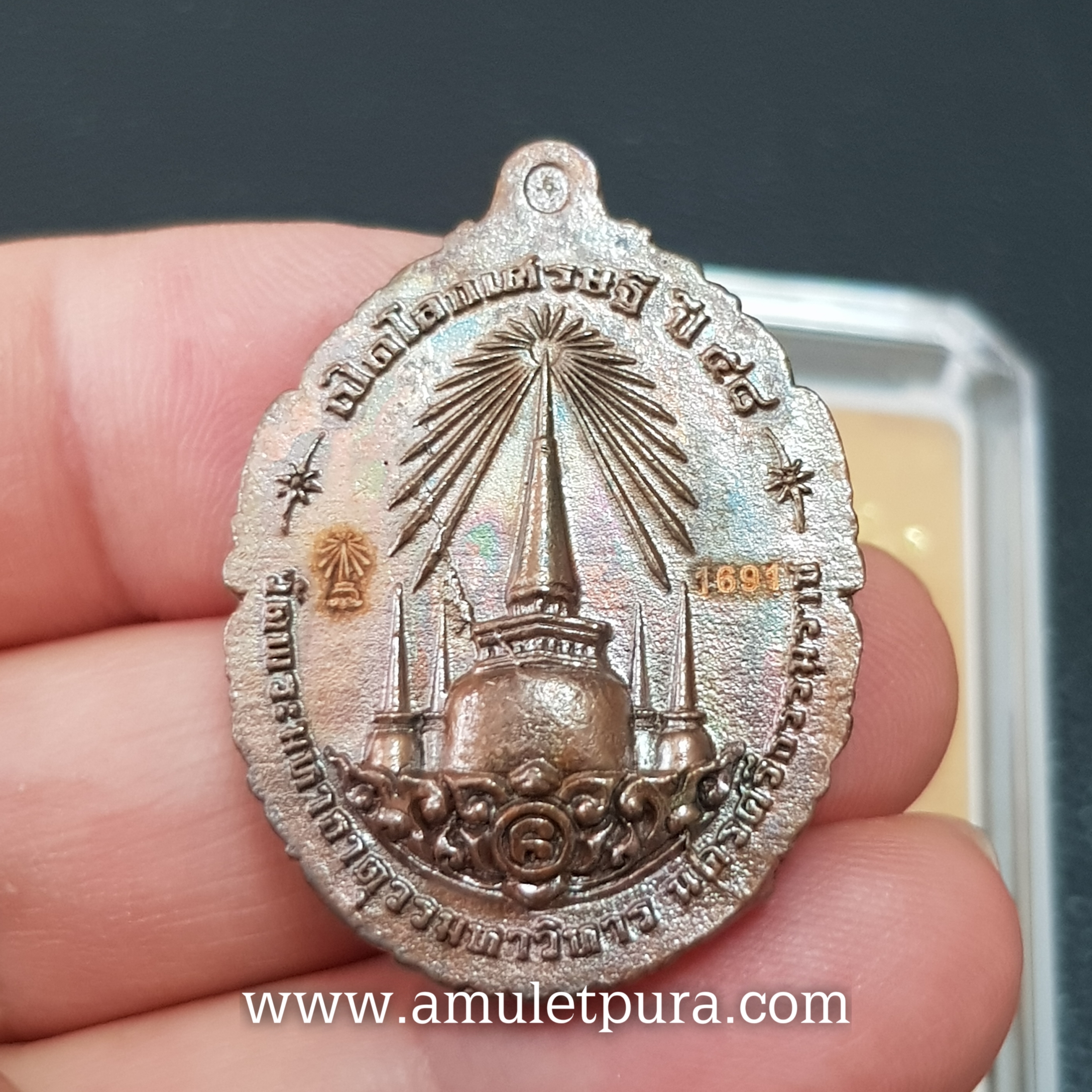 เหรียญหล่อหลวงปู่ทวดบรรจุกริ่ง เนื้อทองแดงผิวไฟ รุ่นเปิดโลกเศรษฐี58 วัดพระมหาธาตุฯ จ.นครศรีธรรมราช (ตอกโค้ด หมายเลข 1691)