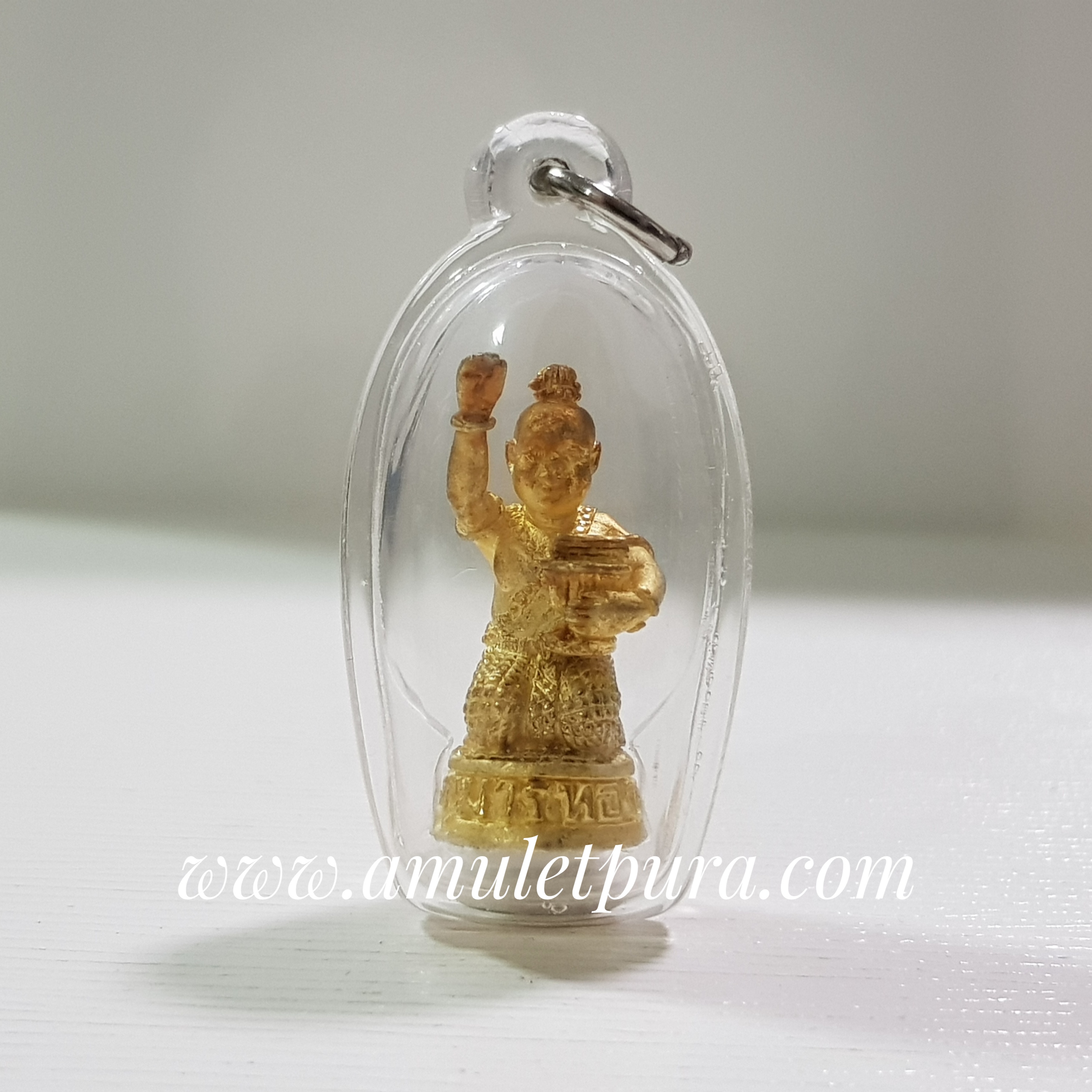 กุมารรับทรัพย์ รุ่นรับทรัพย์(โลหะชุบทองปัดเงา)ปี45 หลวงปู่ชื่น วัดตาอี จ.บุรีรัมย์(ตอกโค้ด อุดผงใต้ฐาน พร้อมเลี่ยมกันน้ำ)